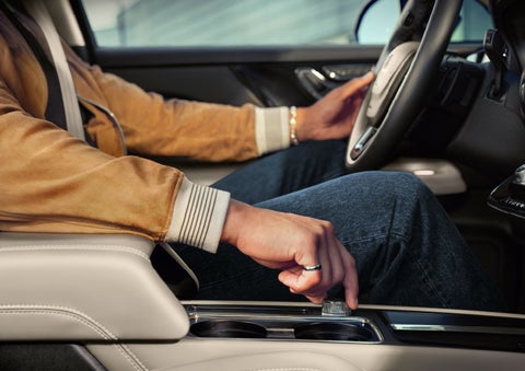 The driver of a 2024 Lincoln Corsair® SUV is shown selecting the drive mode. | Astro Lincoln in Pensacola FL