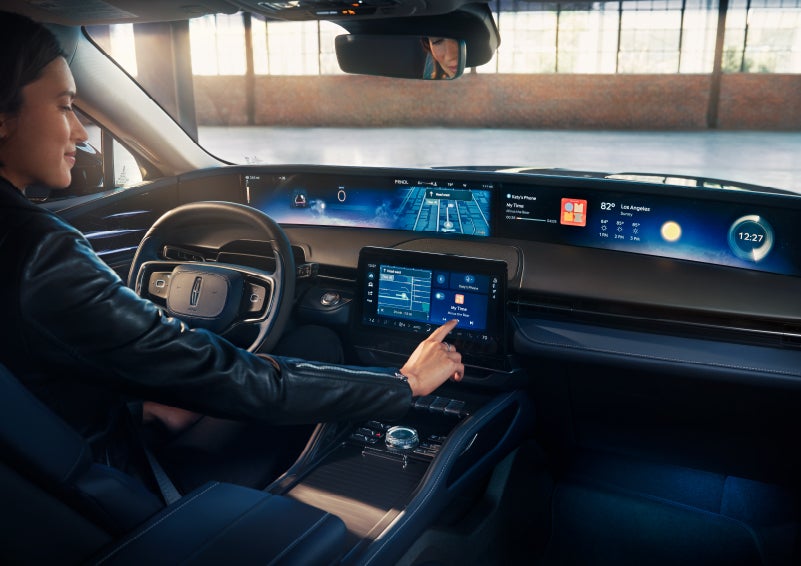 The driver of a 2025 Lincoln Nautilus® SUV interacts with the center touchscreen. | Astro Lincoln in Pensacola FL