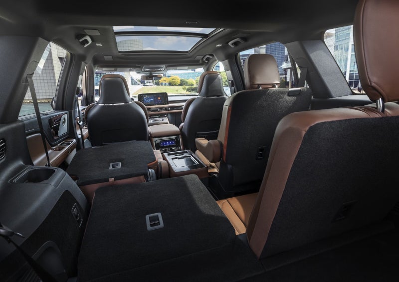 One side of the PowerFold® third-row seat and a second-row seat are folded forward in the 2026 Lincoln Aviator® SUV. | Astro Lincoln in Pensacola FL