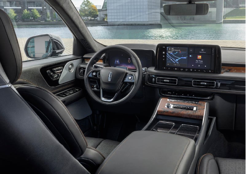 The interior of the 2026 Lincoln Aviator® SUV is shown parked with a view of a harbor through the windshield. | Astro Lincoln in Pensacola FL