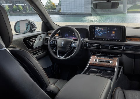 The interior of the 2026 Lincoln Aviator® SUV is shown parked with a view of a harbor through the windshield. | Astro Lincoln in Pensacola FL