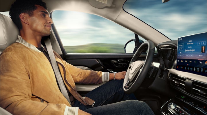 A person is shown using Lincoln BlueCruise hands-free highway driving technology on a divided highway in a hands-free Blue Zone. | Astro Lincoln in Pensacola FL