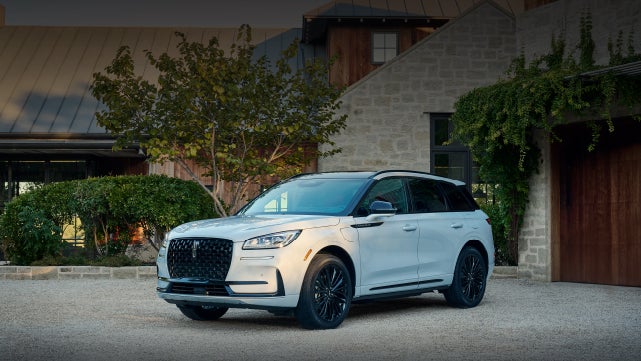 A 2026 Lincoln Corsair® SUV is parked in front off a luxury home. | Astro Lincoln in Pensacola FL