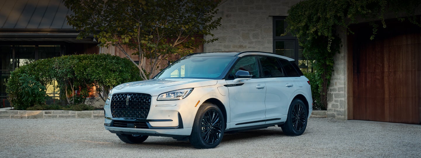 A 2026 Lincoln Corsair® SUV is parked in front off a luxury home. | Astro Lincoln in Pensacola FL