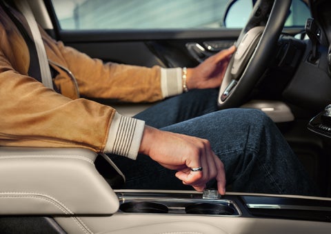 The driver of a 2026 Lincoln Corsair® SUV is shown selecting a drive mode. | Astro Lincoln in Pensacola FL