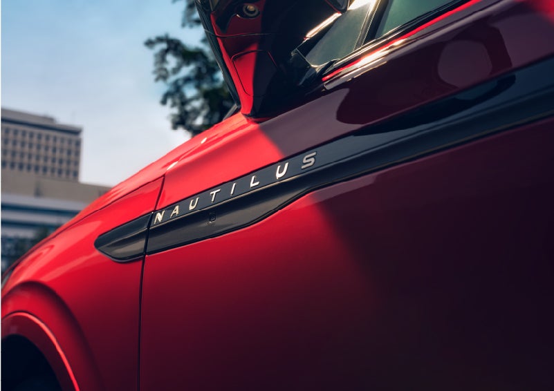 A side badge on the passenger door reads Nautilus. | Astro Lincoln in Pensacola FL