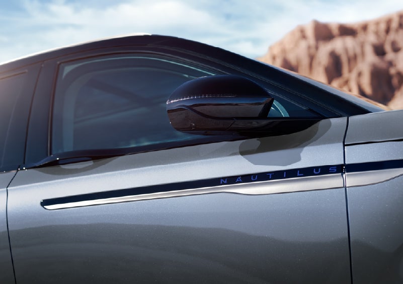 Blue lettering on the side of the vehicle that reads Nautilus indicates the available Hybrid Powertrain. | Astro Lincoln in Pensacola FL