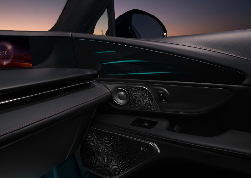 Selectable ambient lighting glows in the passenger door panel. | Astro Lincoln in Pensacola FL