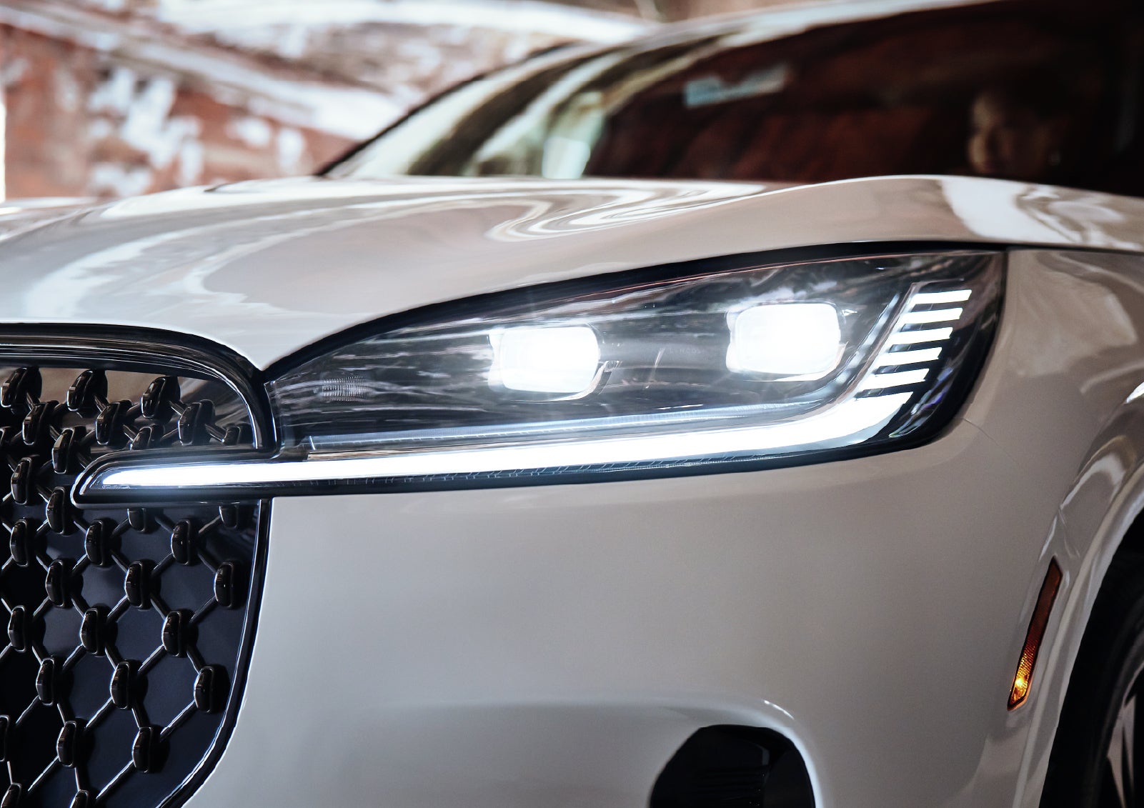 A close-up of a headlamp on the 2027 Lincoln Aviator® SUV is shown. | Astro Lincoln in Pensacola FL