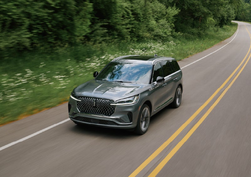 A 2027 Lincoln Aviator® SUV is being driven down a road. | Astro Lincoln in Pensacola FL