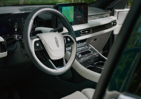The leather-trimmed steering wheel of a 2027 Lincoln Aviator® Black Label™ SUV. | Astro Lincoln in Pensacola FL
