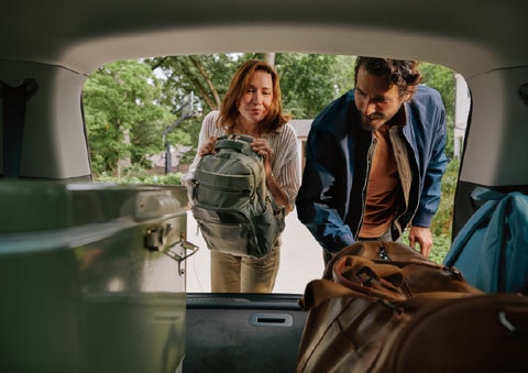A couple loads luggage into the rear of a 2027 Lincoln Aviator® Black Label™ SUV..e 202 | Astro Lincoln in Pensacola FL