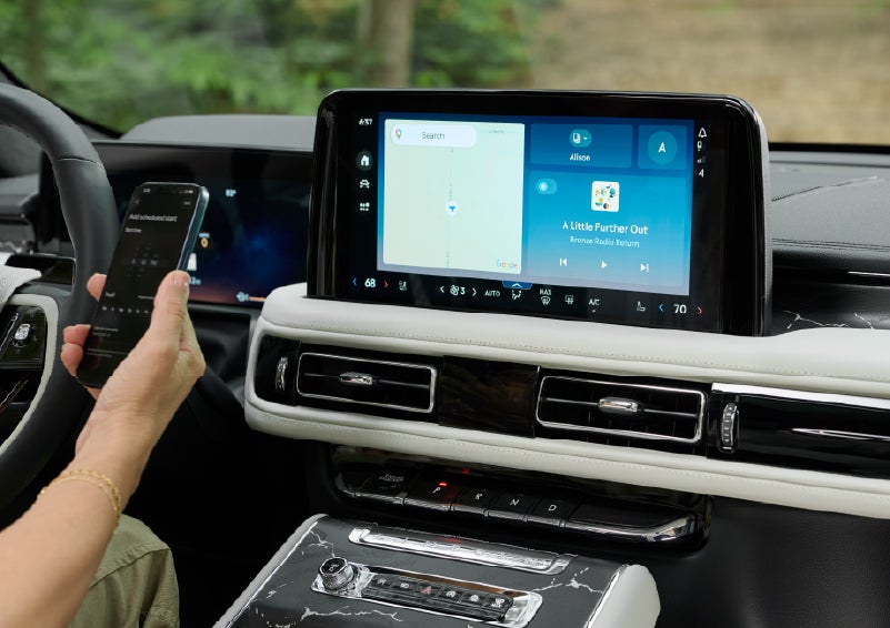 A person pairs thier phone with the center touchscreen of a 2027 Lincoln Aviator® Black Label™ SUV | Astro Lincoln in Pensacola FL